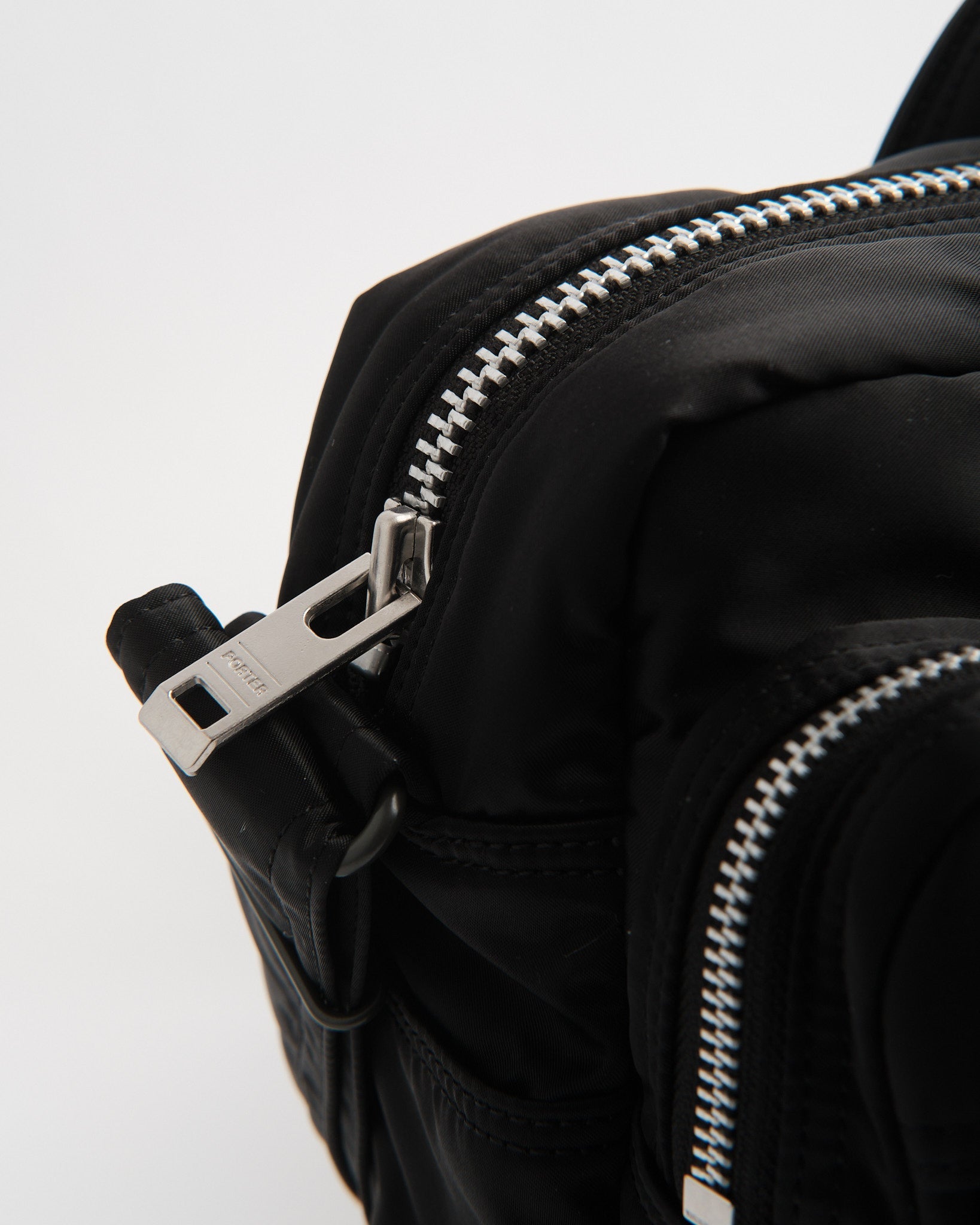 porter | New Tanker Sling Bag W Zip (XL) Black | meadow