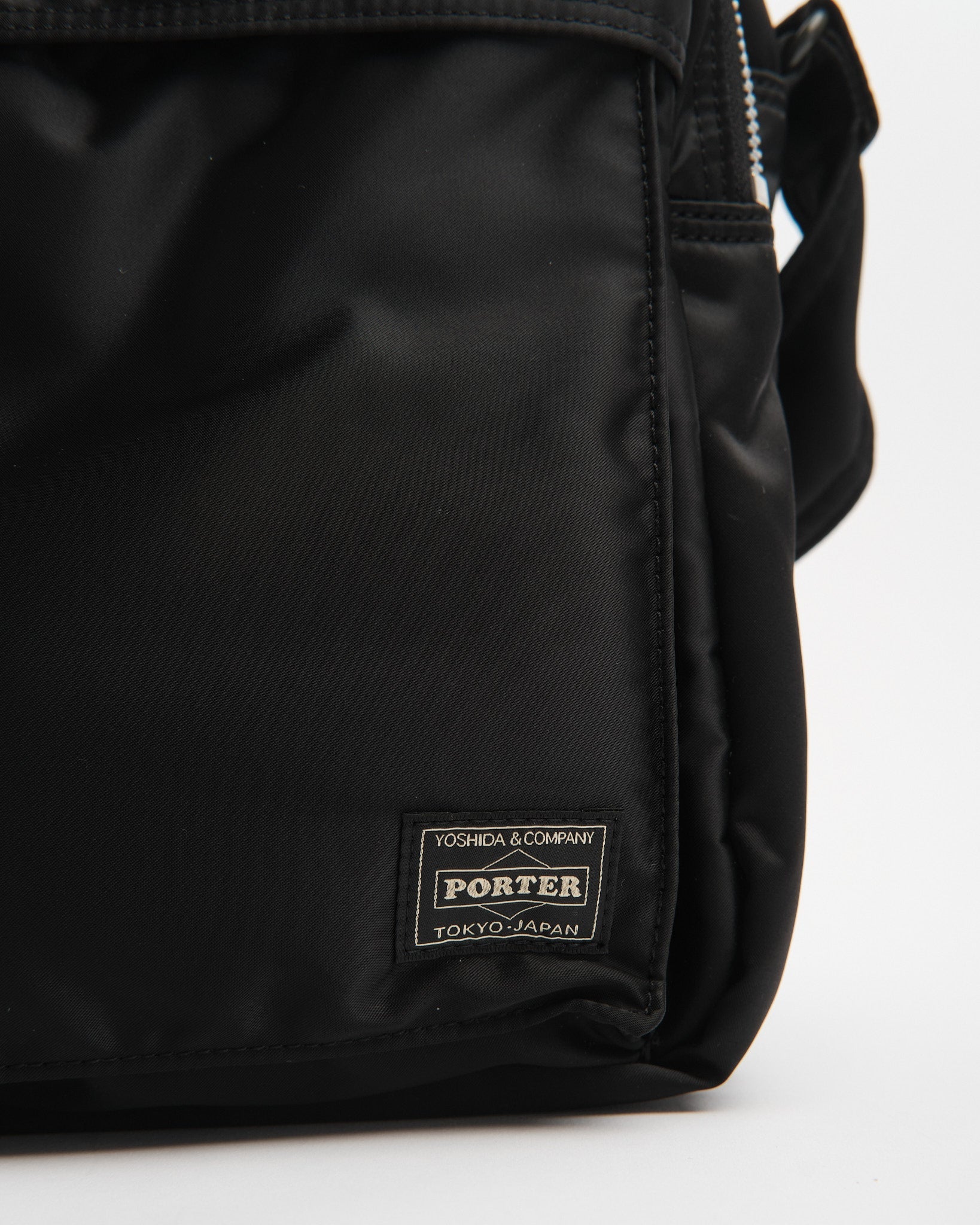 porter | New Tanker Sling Bag W Zip (XL) Black | meadow