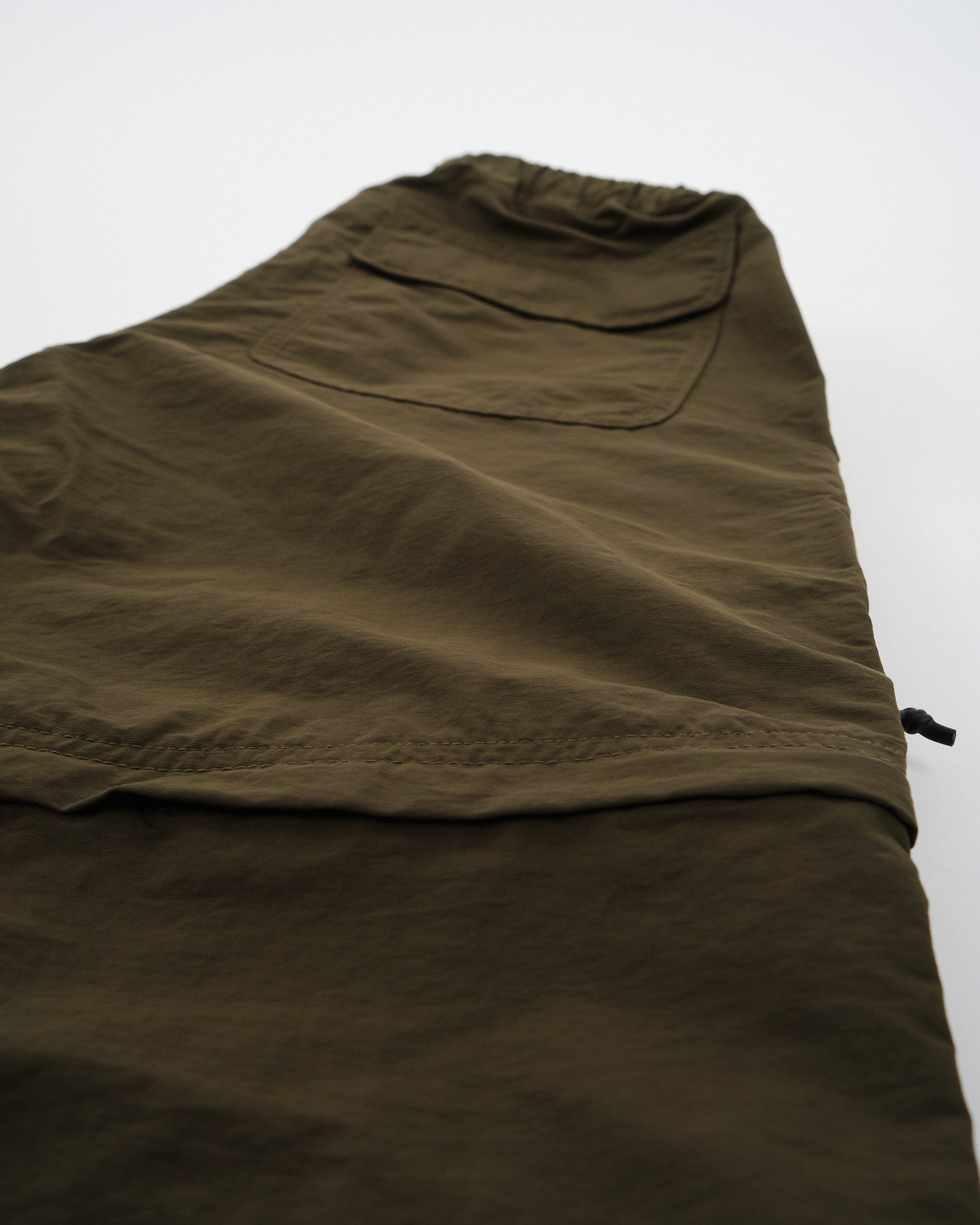 CLUBHAUS × TANGRAM / NYLON PANTS OLIVE CLUBHAUS × TANGRAM DICE NYLON TRAINING PANTS OLIVE TGA-MP56